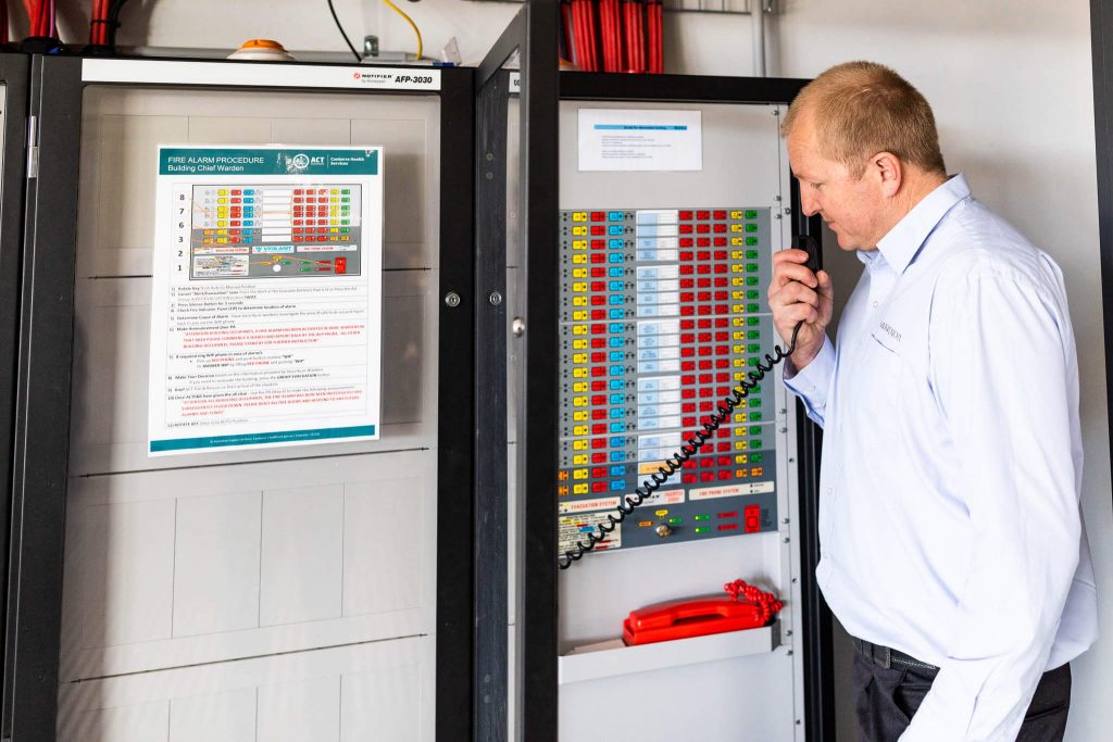 building manager checking on fire system