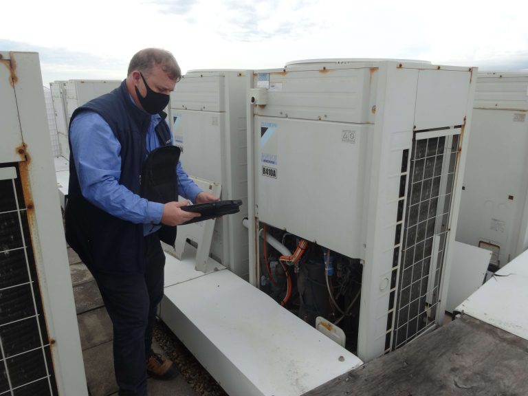 Engineers are checking the air cooled chiller, located on the roofs of the building.